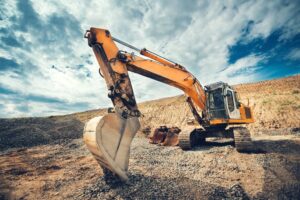 What type of mini excavator is recommended when working in tight spaces?